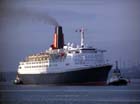  QE2 Zoom With QM2 Casting Shadow